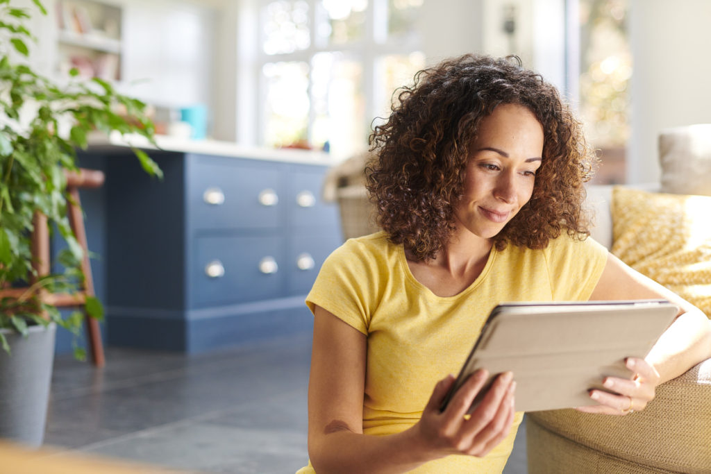 a woman checking her home finances over the phone
